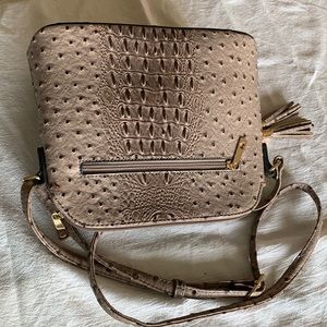 Crossbody faux reptile taupe handbag. Gold metals In & out zipper pockets.